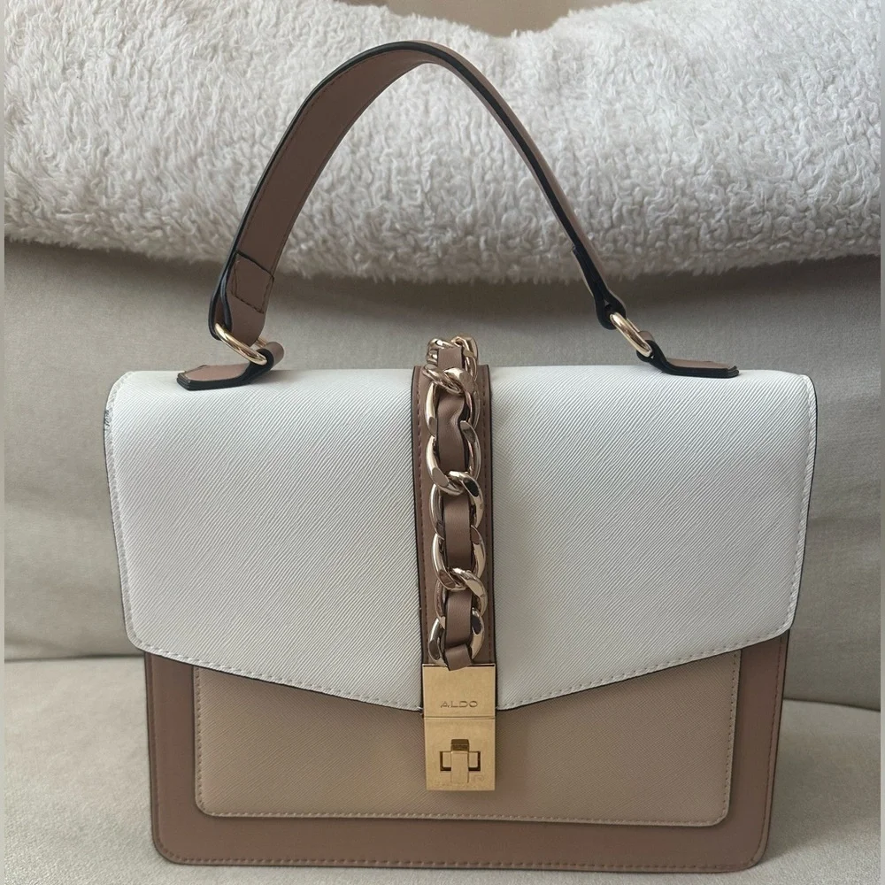 ALDO women's handbag with a top handle and chain detail.